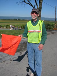 Volunteer directing traffic